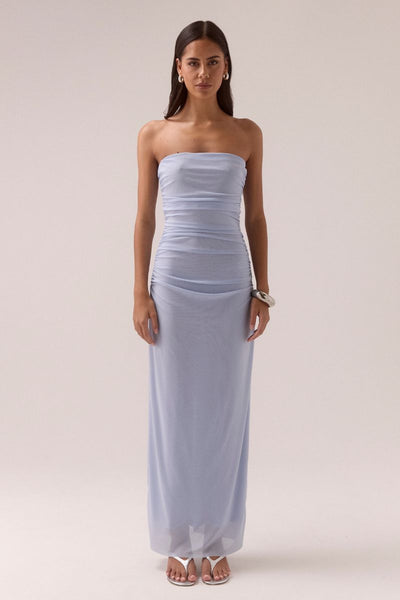 Model wearing SOVERE Studio Myriad Bolero Dress in Cool Blue, strapless mesh maxi with ruched sides 