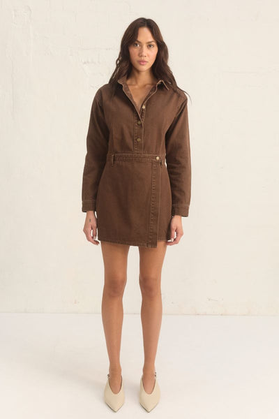 Model wearing the Mon Renn Bayside Denim Dress in coffee — a structured long sleeve mini dress with a button front and wrap skirt.