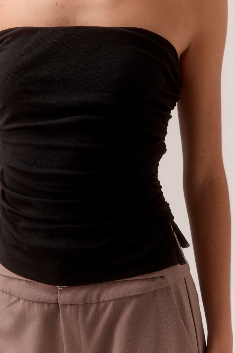 Close-up of SOVERE STUDIO MYRIAD black ruched strapless top