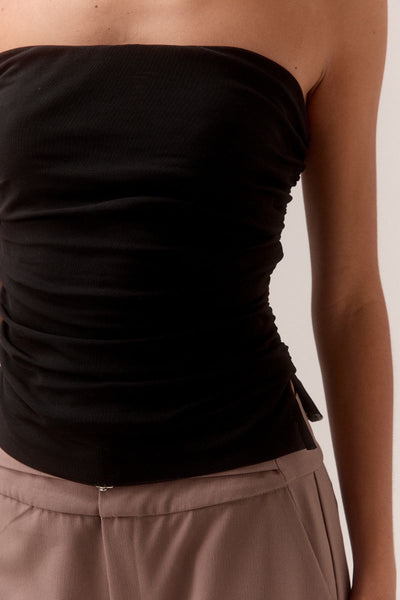 Close-up of SOVERE STUDIO MYRIAD black ruched strapless top